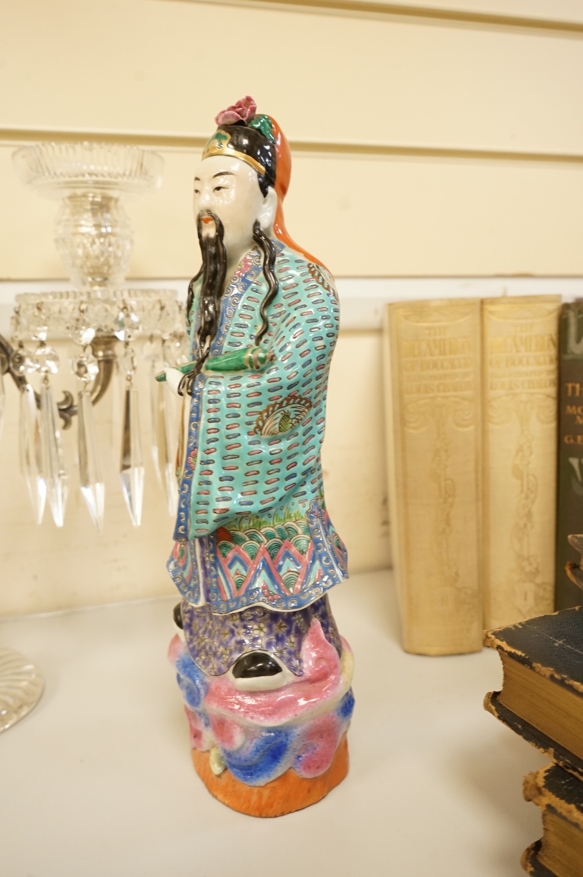 A Chinese enamelled porcelain figure of an immortal, Republic period, 32.5cm high